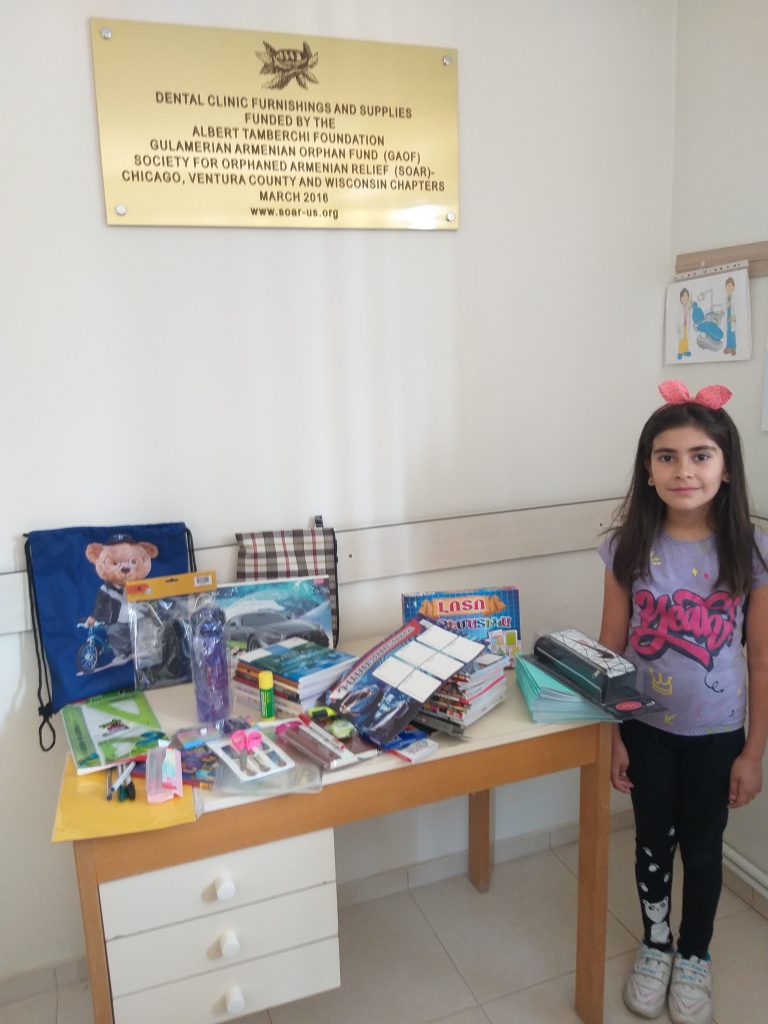 Aghunik Harutyunyan received school supplies and clothes