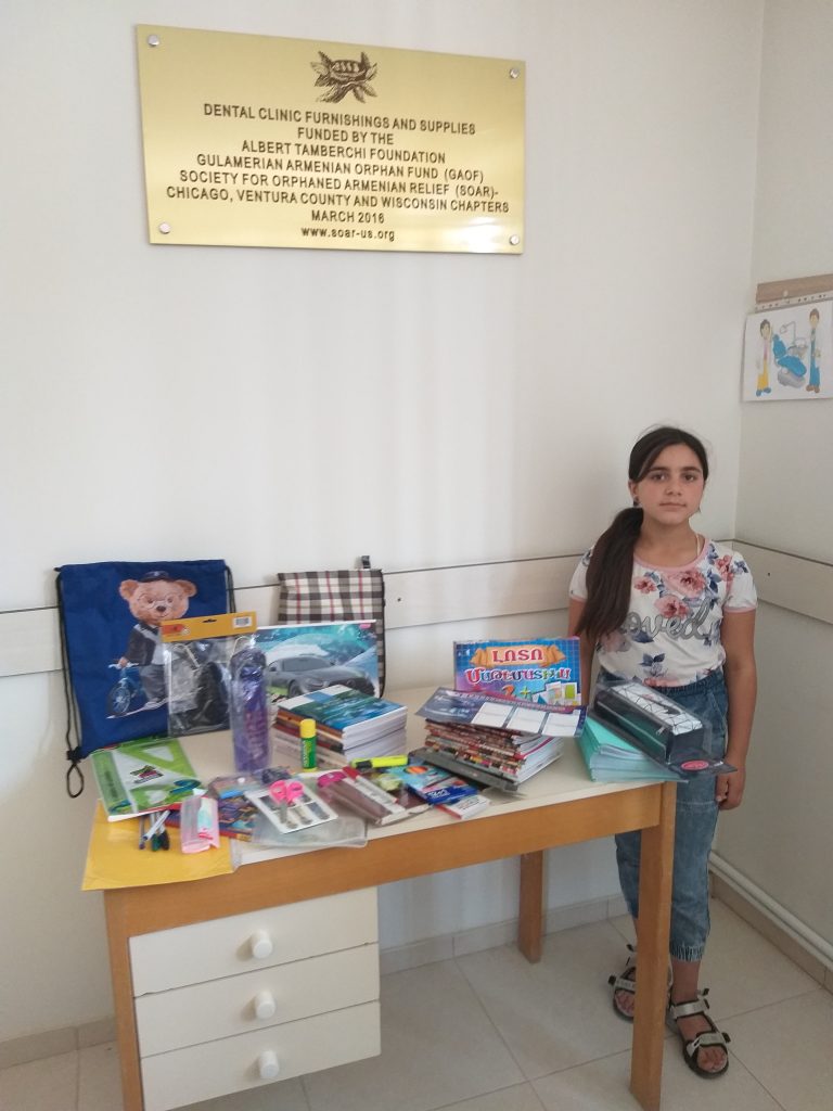Mariam Aghayan received school supplies and clothes