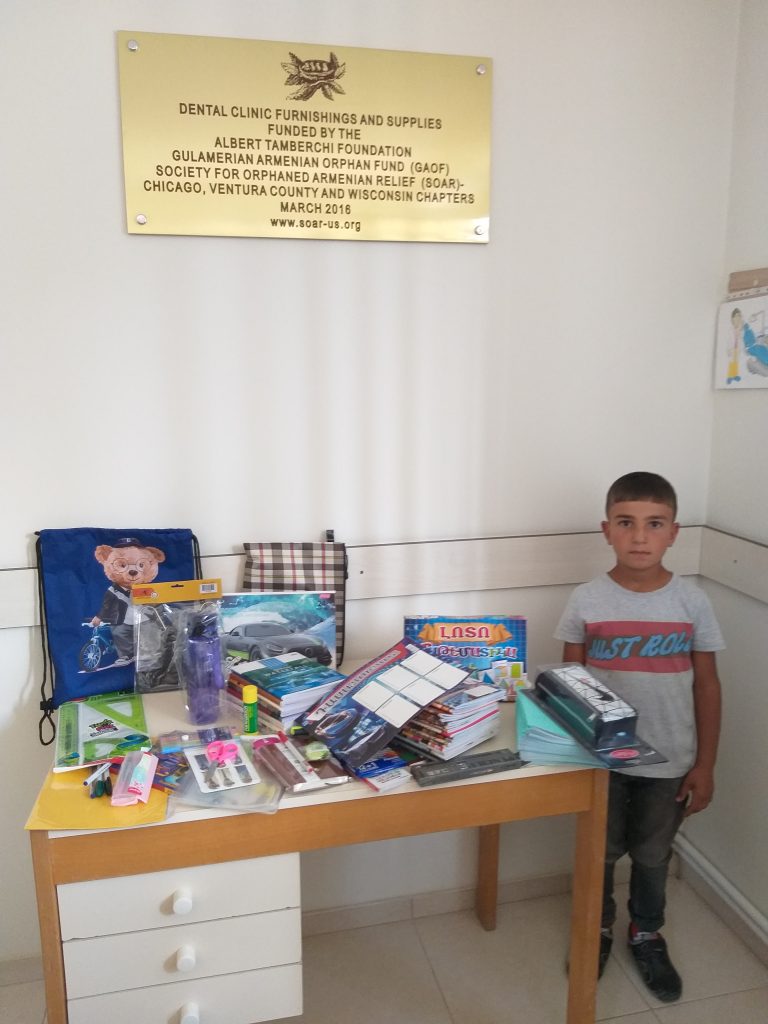 The Saribekyan family received school supplies and clothes